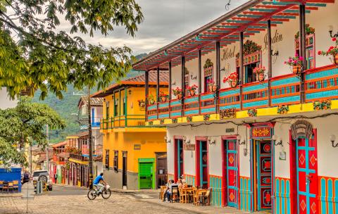 Link to Amercias program pages. Image of a street in Antioquia, Colombia