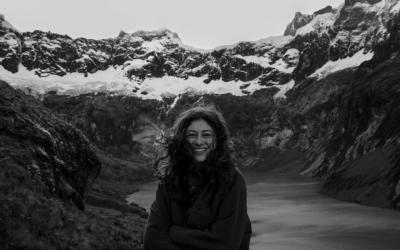 Black and white photo of Student, Lena Wehn, against a backdrop of mountains and a lake